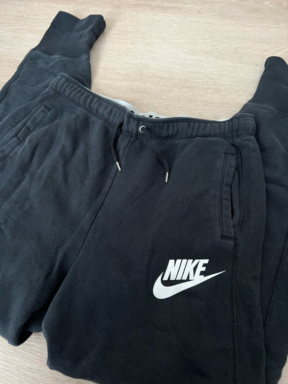 Nike Black Jogger Sweatpants with White Logo and Text on Inner Waistband